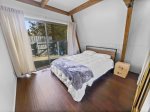 Bright and airy third bedroom with a queen